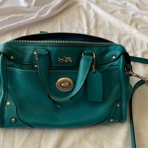 Teal blue coach purse.